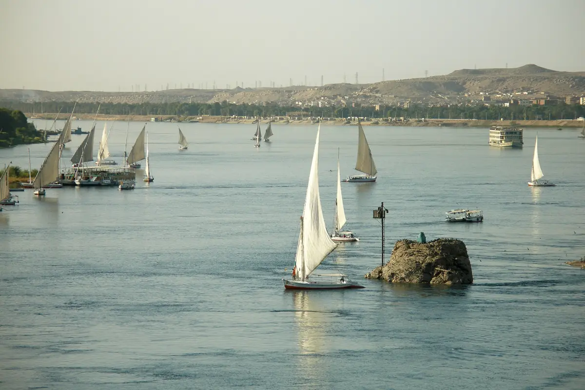 White sails among the rocks of the Nile at Aswan